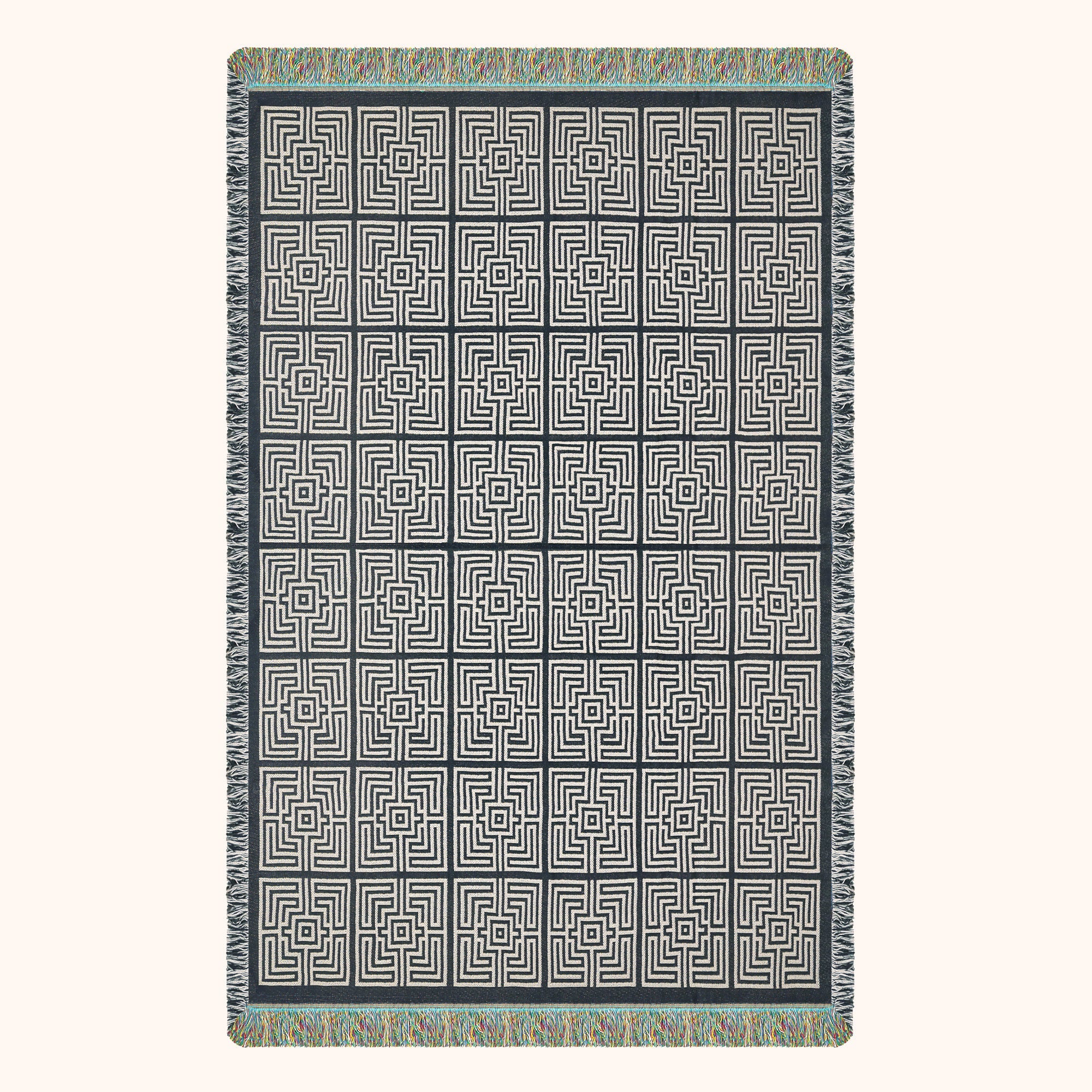 Patterned woven blanket with geometric design; black and ivory.